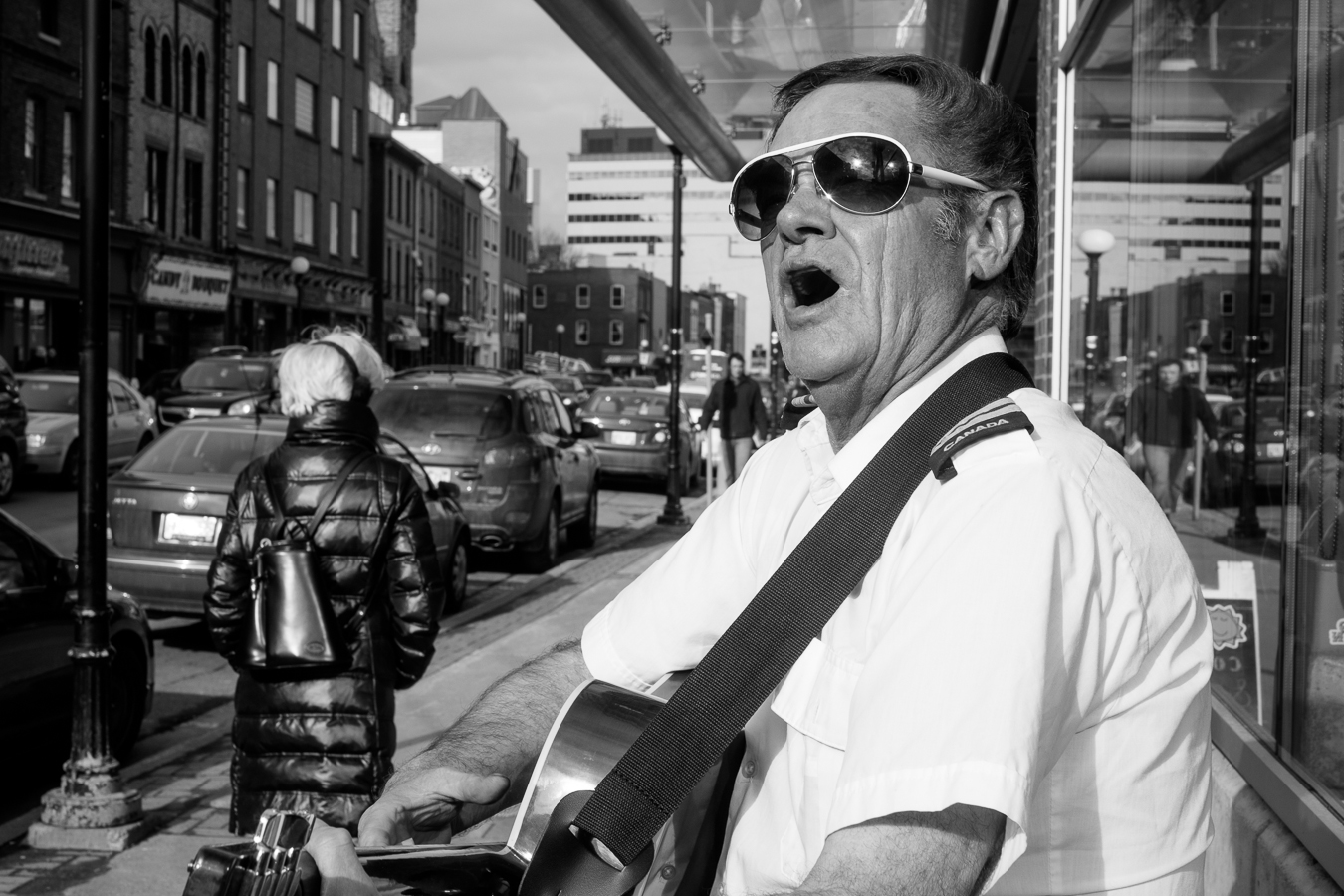 This guy harasses more than busks, He's got a monster of a voice - Atlantic Place - water street  