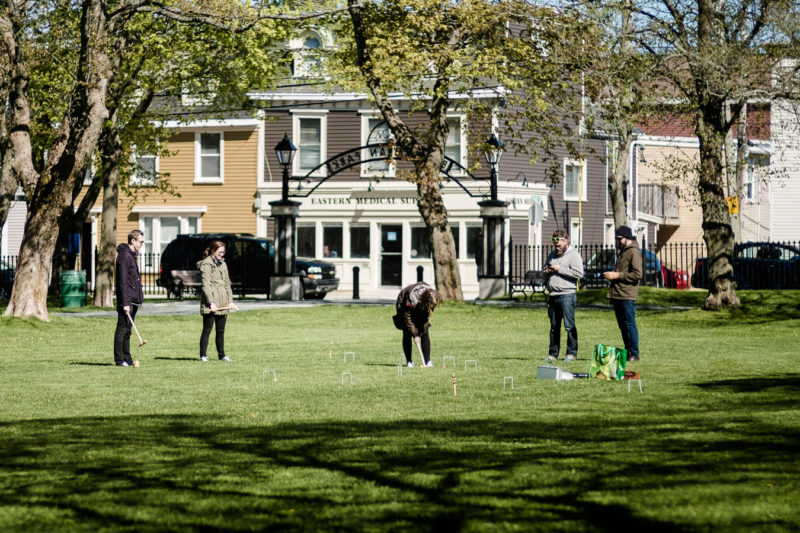 Members of Perfect Day Design Studio have a game of croquet - Bannerman Park